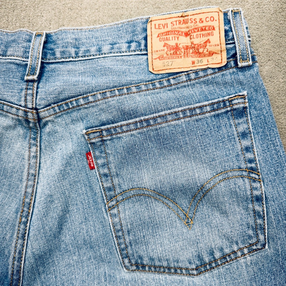 Vintage Levis 527 Low Boot Cut Jeans Mens 36x34 Light Wash Blue Denim Raw Hem